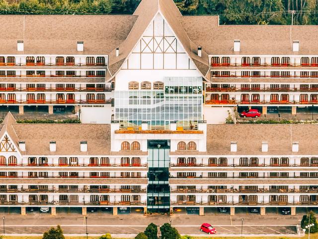 Large hotel set among green mountains